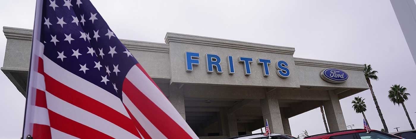 Fritts Ford building with American Flag